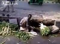 Man Washing Vegetables Using Sewerage Water In India